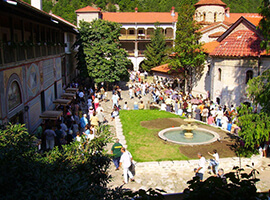 Tourists inside the monastery's courtyard.