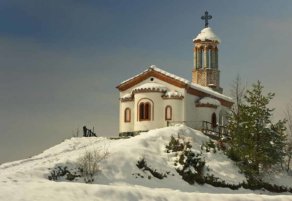 The chapel covered with snow in the winter.